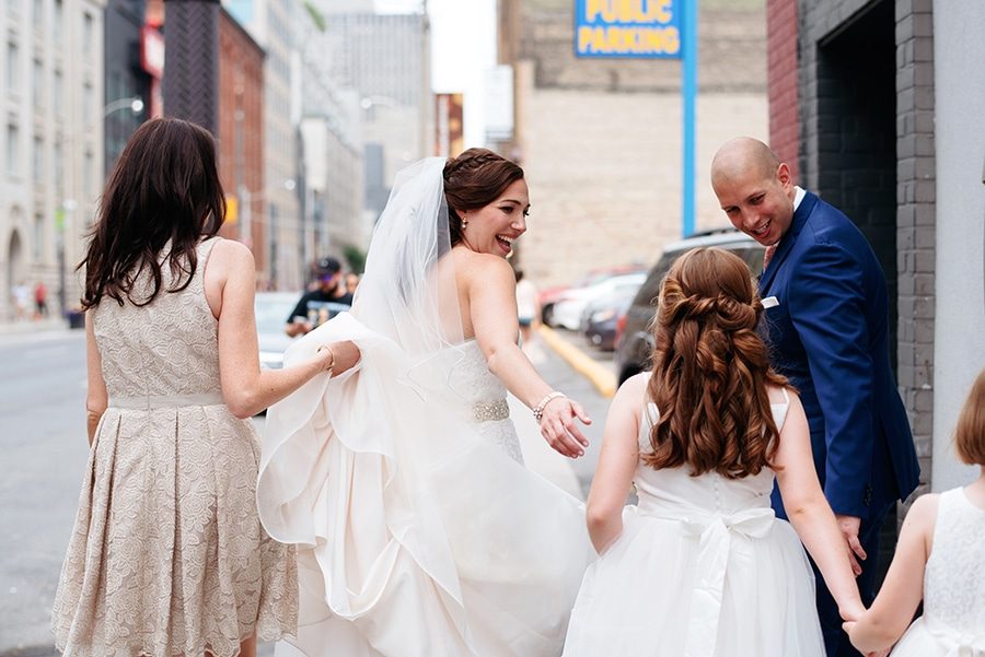 Bride and groom walking with their wedding party